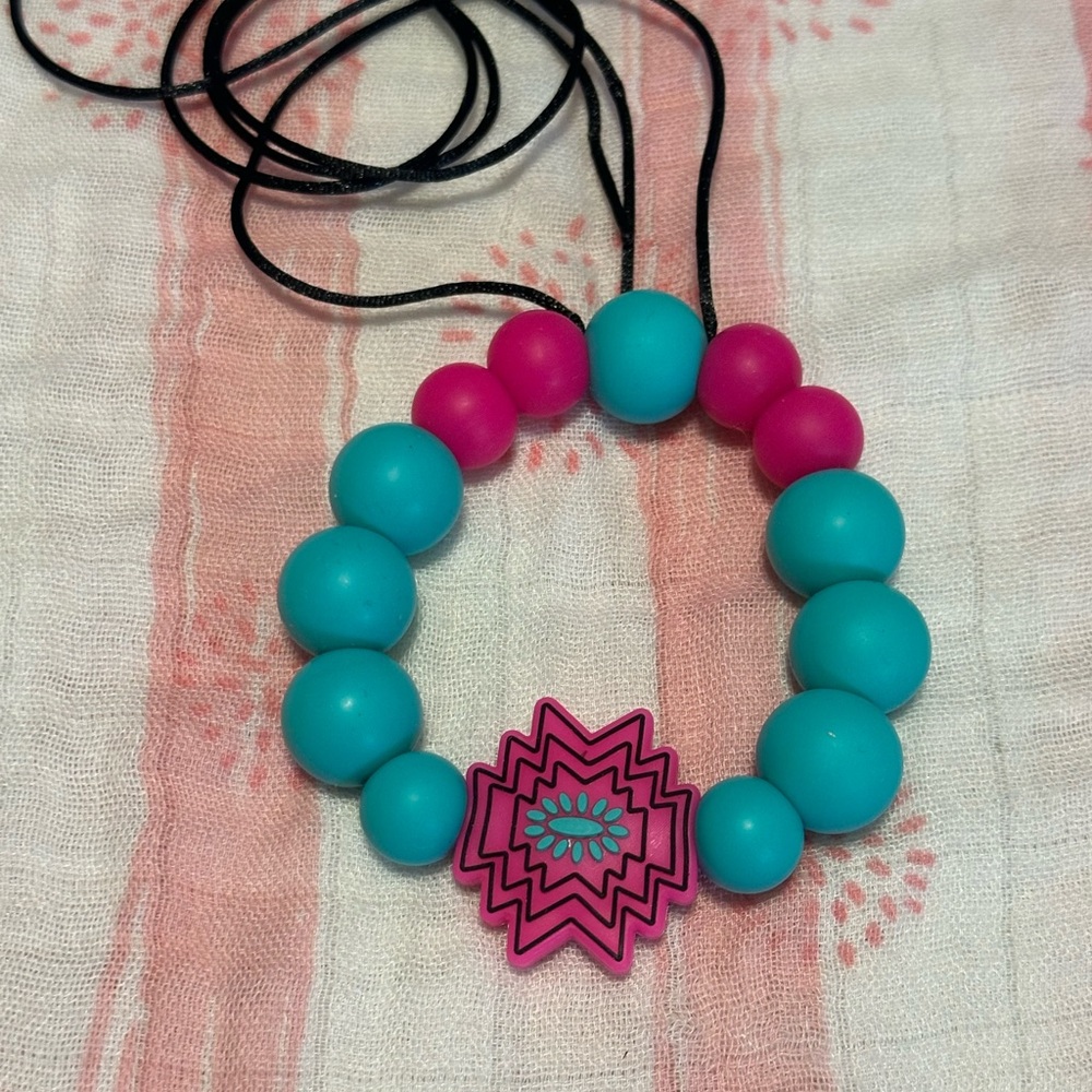 Pink and teal rear view mirror hanger